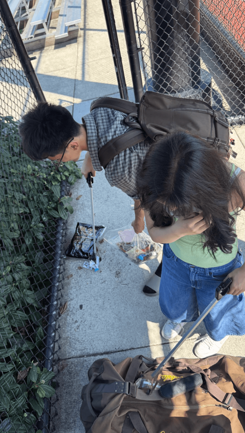Picking up litter along the fence line